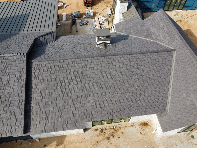 Overhead drone photo of a large Enviroshake roof with metal accents