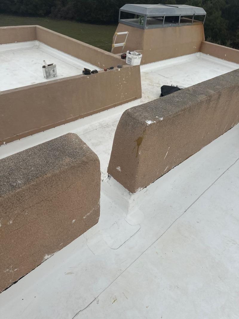 TPO membrane wrapped over multiple parapet walls on a flat roof